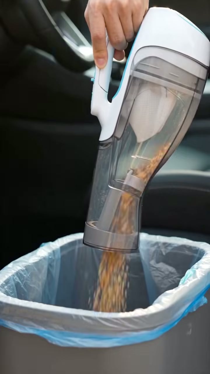 The canister pops off and empties straight into the bin