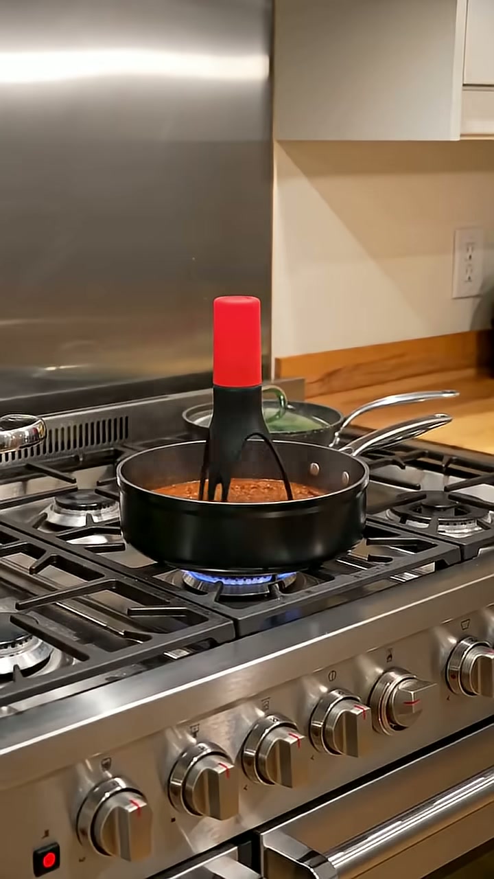 A battery stirrer that sits in the pot and turns itself