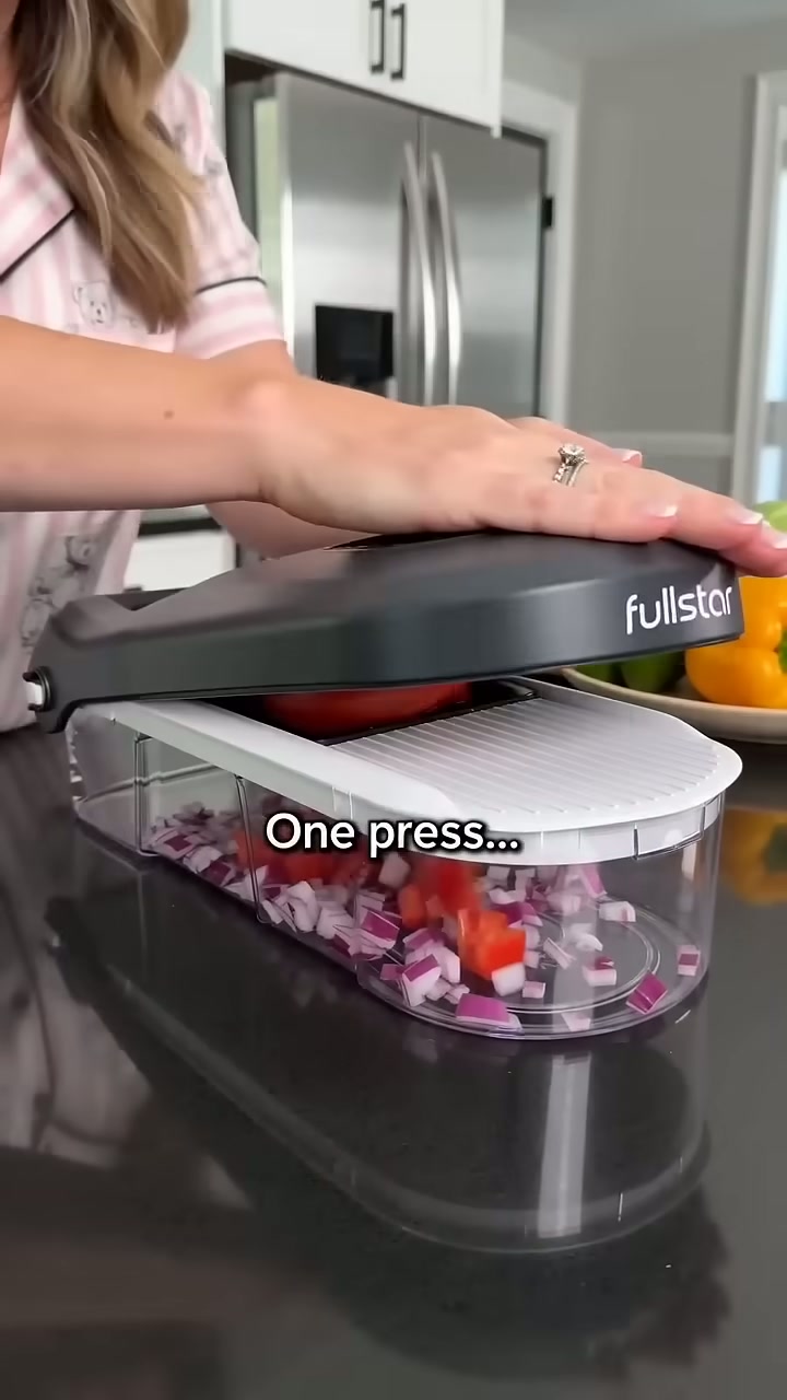 One press dices a whole onion into the catch tray below