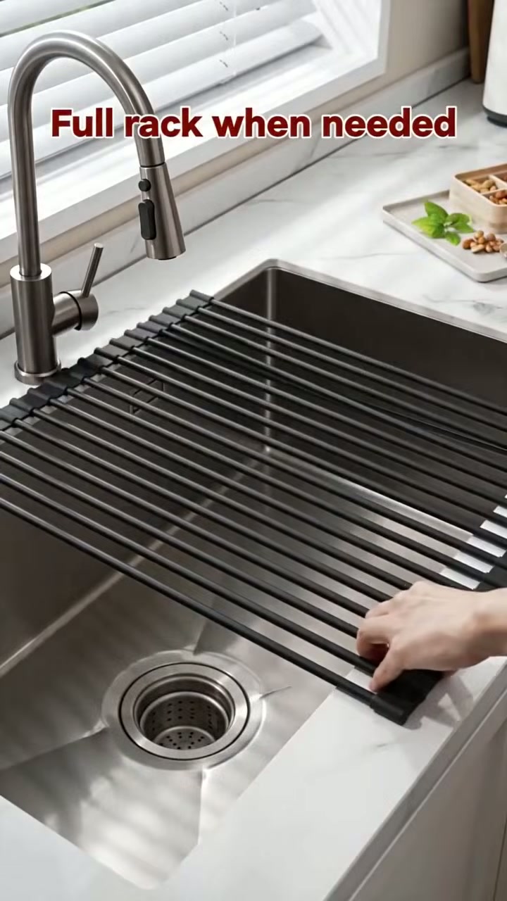 A roll-up rack that lays over the sink for drying dishes