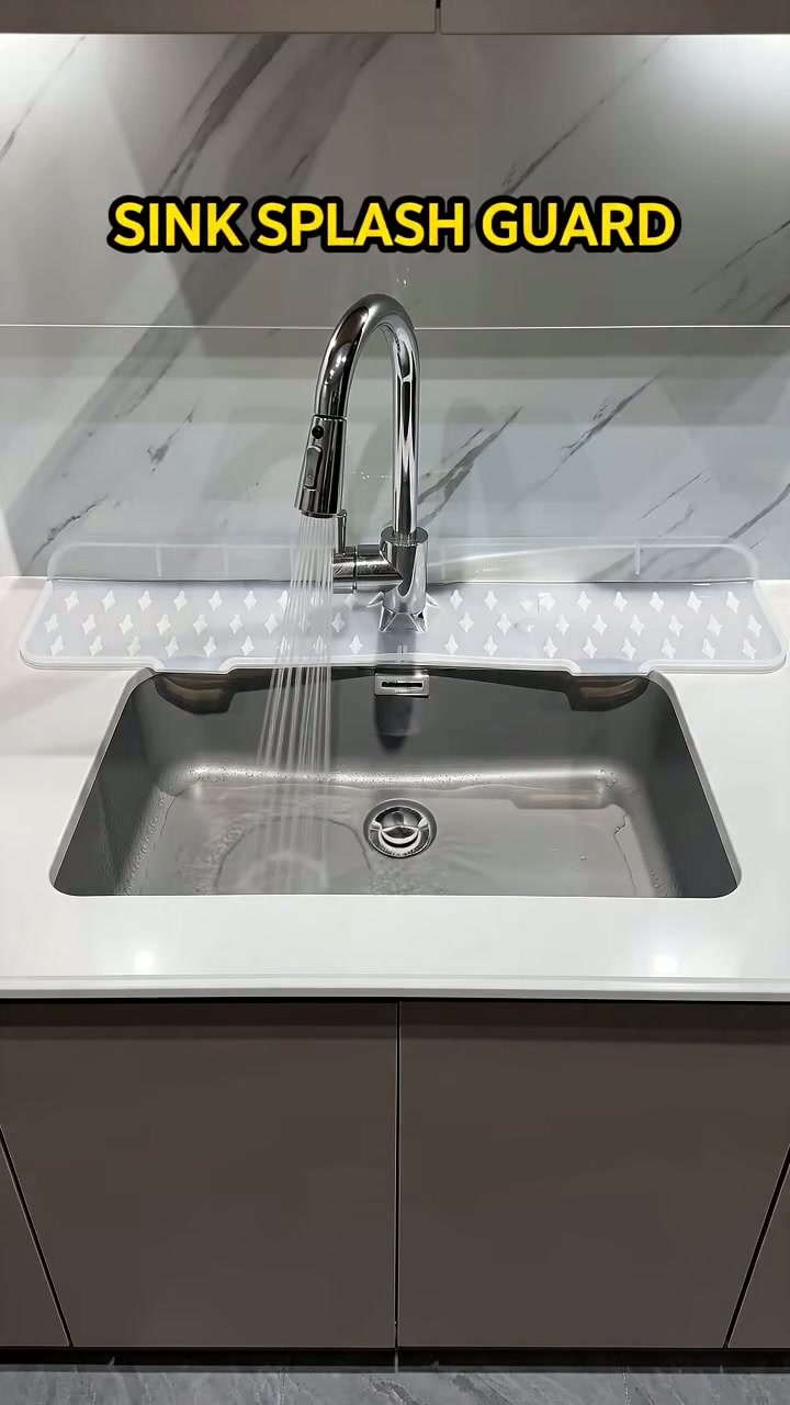 A silicone guard mat that sits behind the tap