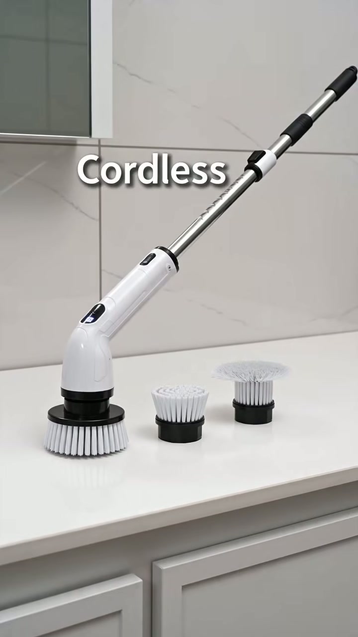 A cordless spin scrubber with interchangeable brush heads
