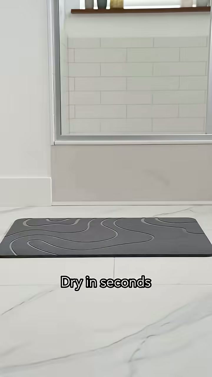 The stone mat sits flat and dries within seconds
