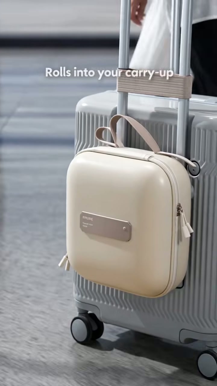Straps onto your carry-on and zips flat so nothing spills